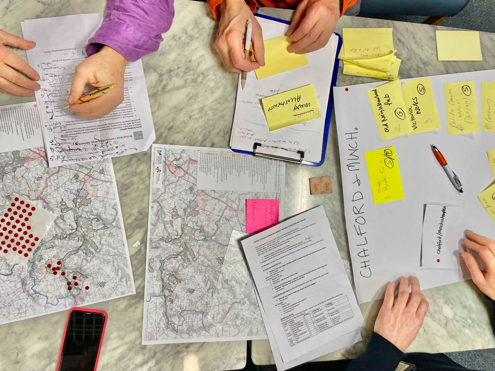 Participants at a planning table at a community energy workshop.